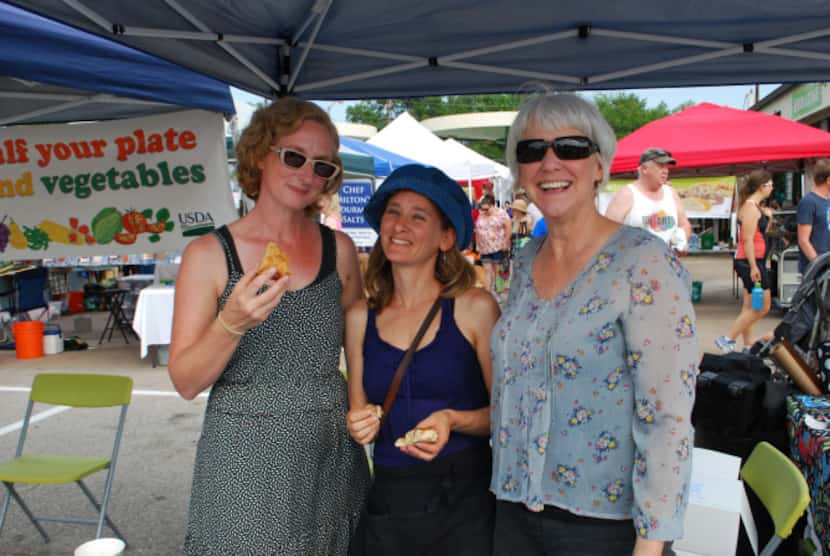 Founder of the White Rock Local Market, Sarah Perry, left, enjoys a pastry with market...