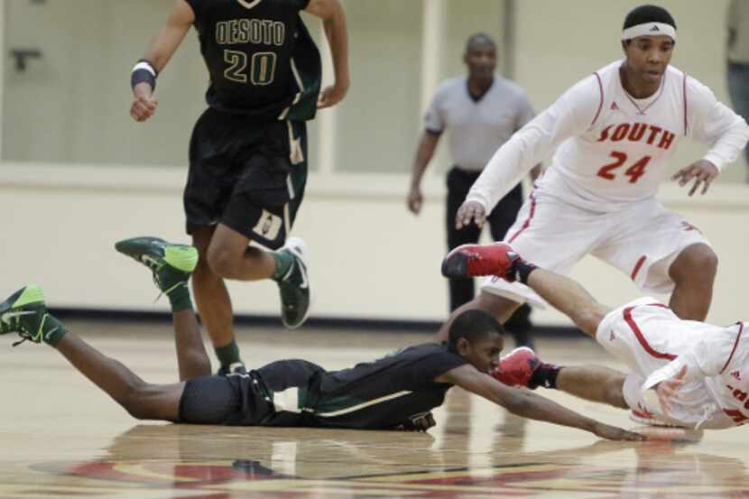 South Grand Prairie junior guard Andrew Montague (0) dives for the ball after forcing DeSoto...