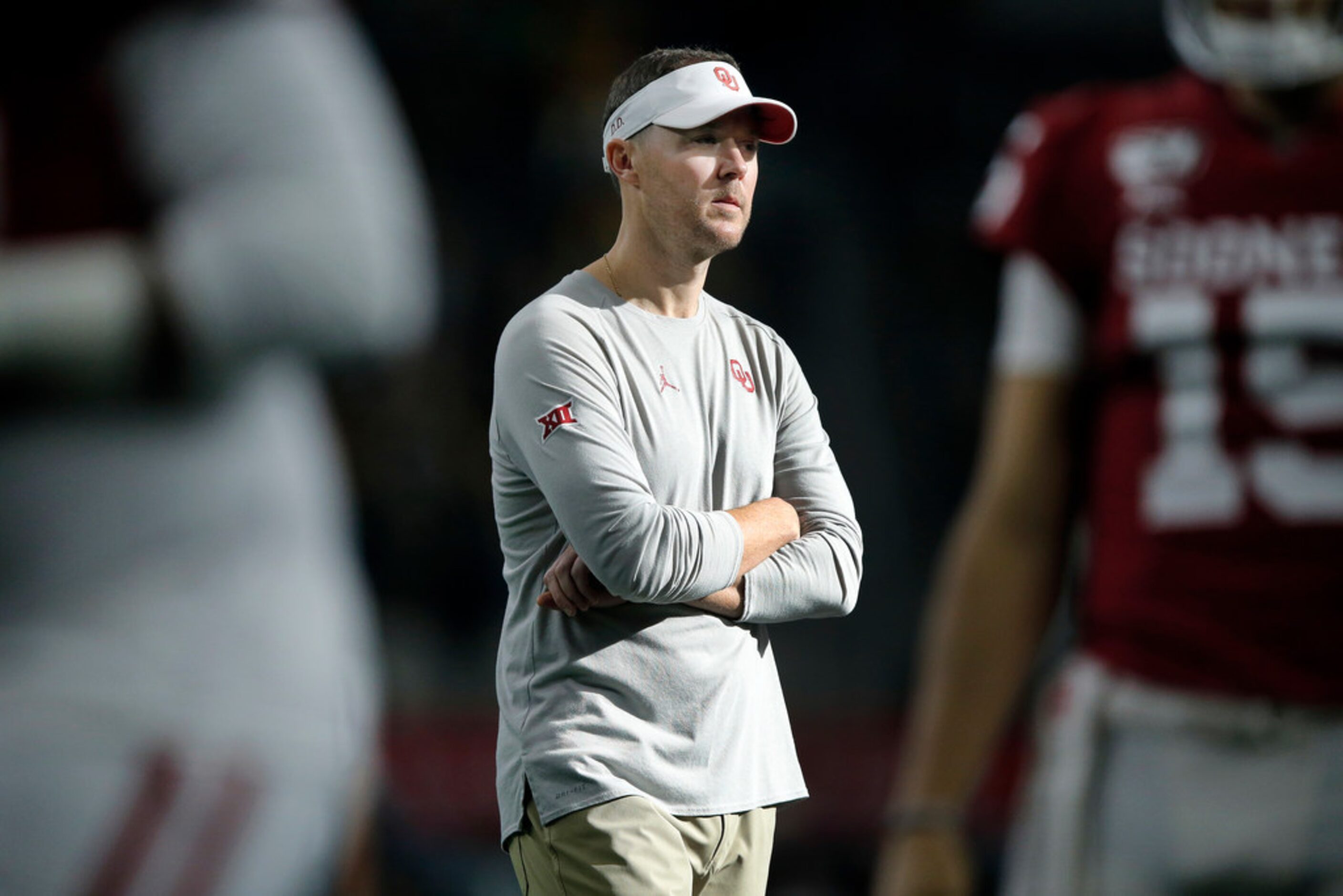 Oklahoma Sooners head coach Lincoln Riley watches his team during warmup before facing the...