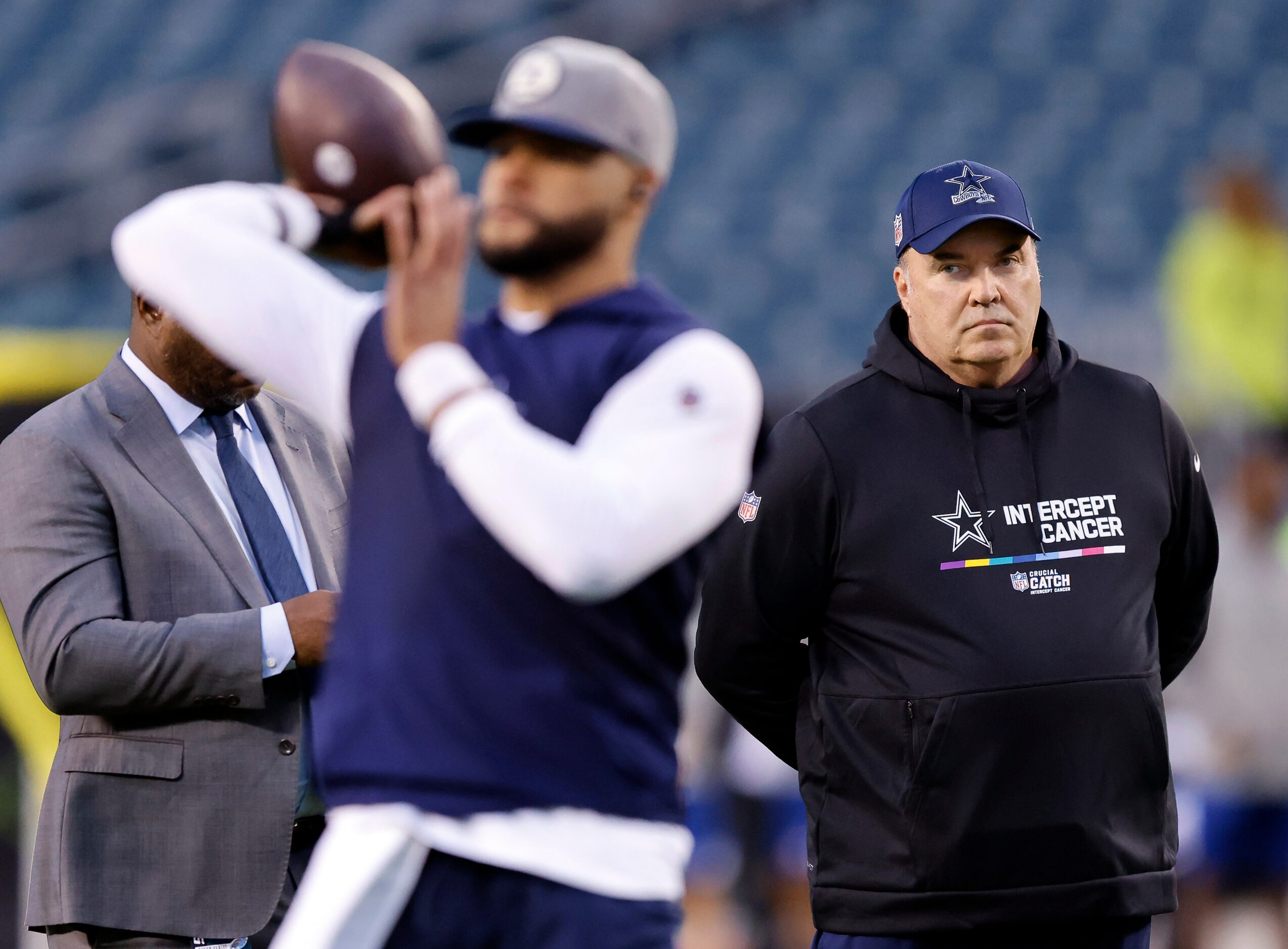 Dallas Cowboys head coach Mike McCarthy watches as quarterback Dak Prescott practices his...