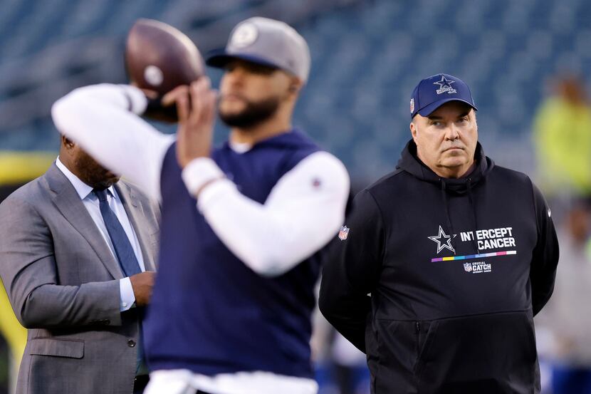 Dallas Cowboys head coach Mike McCarthy watches as quarterback Dak Prescott practices his...