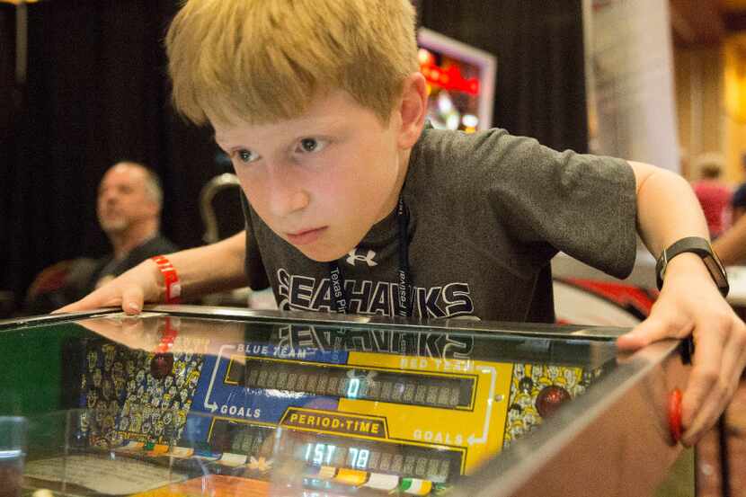 James Zsohar,9,  is the picture of  of concentration as he plays his brother, Owen Zsohar,9,...