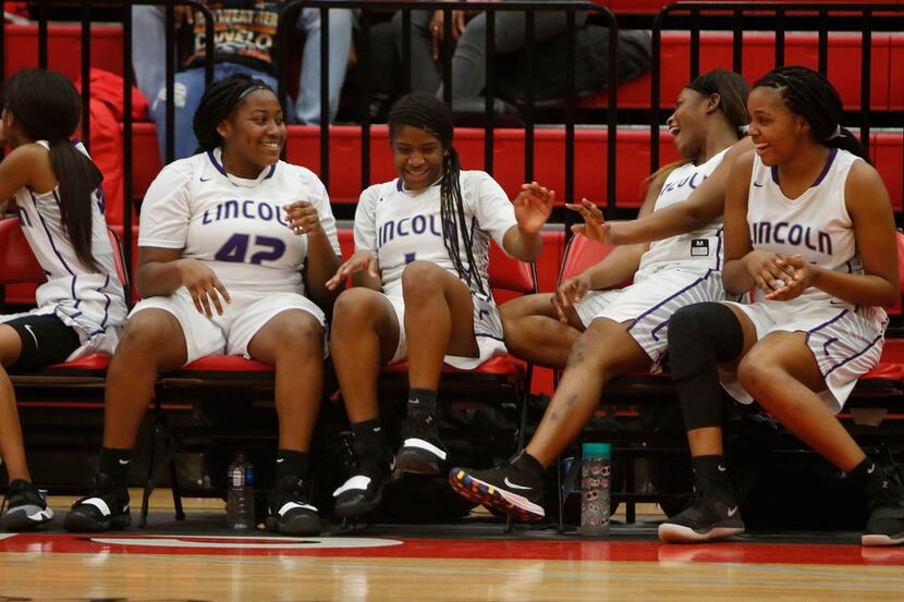 The Dallas Lincoln bench had plenty to smile about in the waning seconds of their victory...