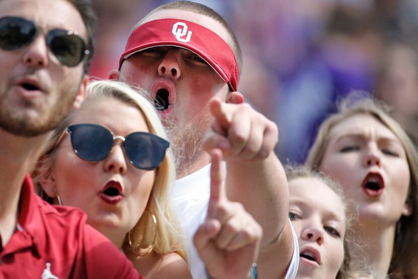 Sooners fan get revved up as Oklahoma pulls away from TCU in the fourth quarter during the...