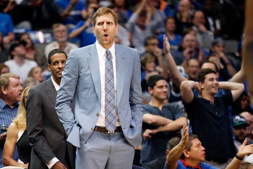 Dallas Mavericks forward Dirk Nowitzki reacts to his teammate bowing fouled during the first...