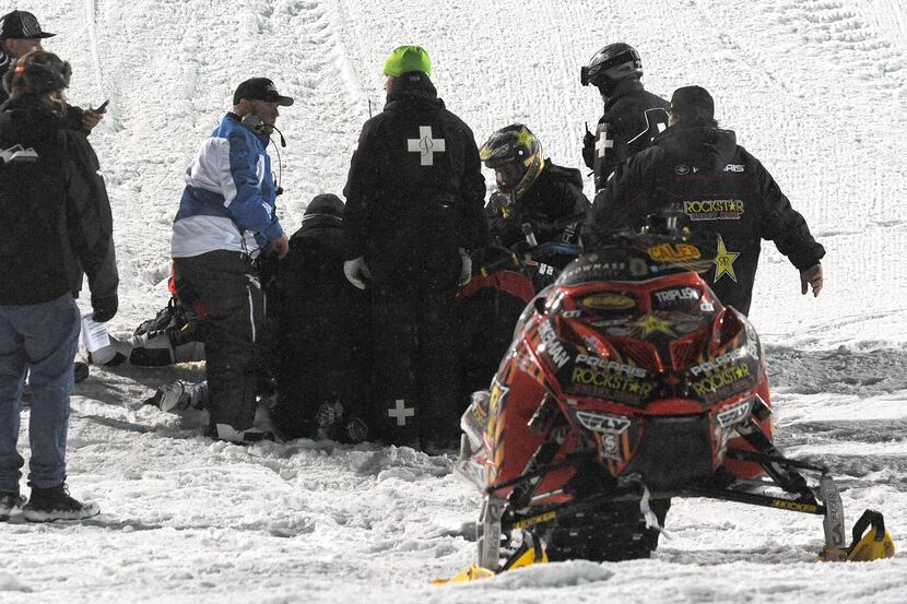 In this photo taken Jan. 24, 2013, emergency personnel tend to Caleb Moore after he crashed...