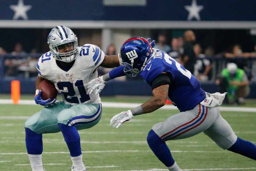 Dallas Cowboys running back Ezekiel Elliott (21) is pictured on a first-quarter run during...