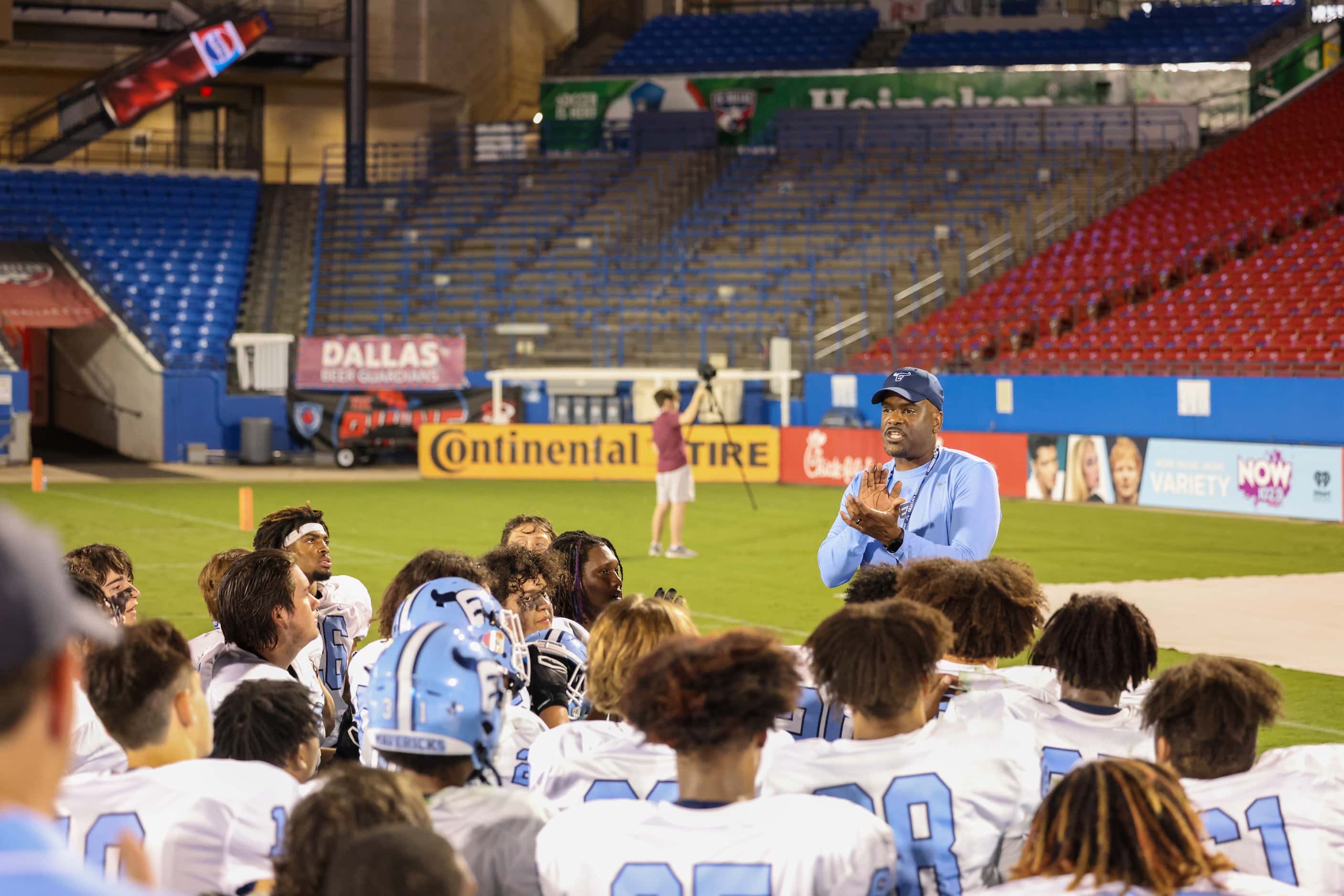Emerson Mavericks head coach Kendall Miller speaks to his team after winning a game against...