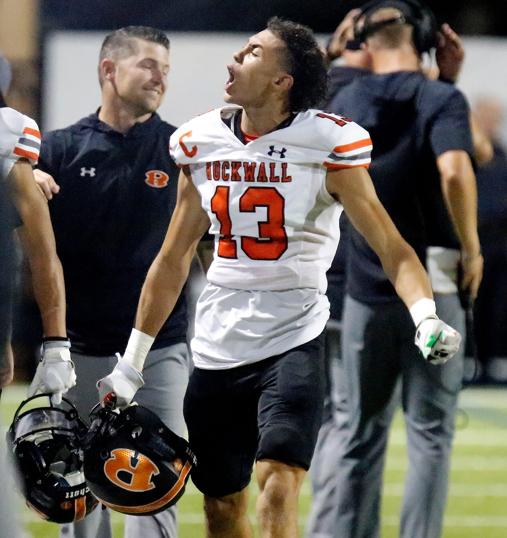 Rockwall High School cornerback Cadien Robinson (13) tries to fire up the crowd after...