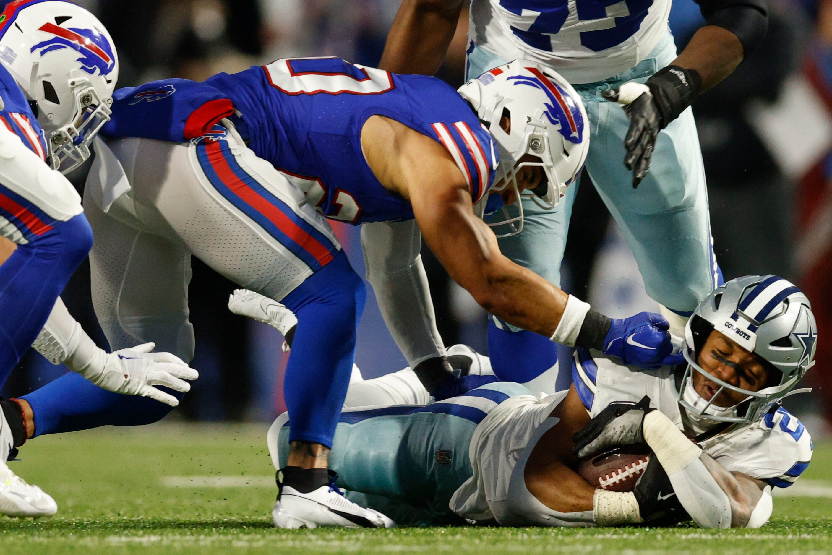 Buffalo Bills safety Taylor Rapp (20) tackles Dallas Cowboys running back Tony Pollard (20)...