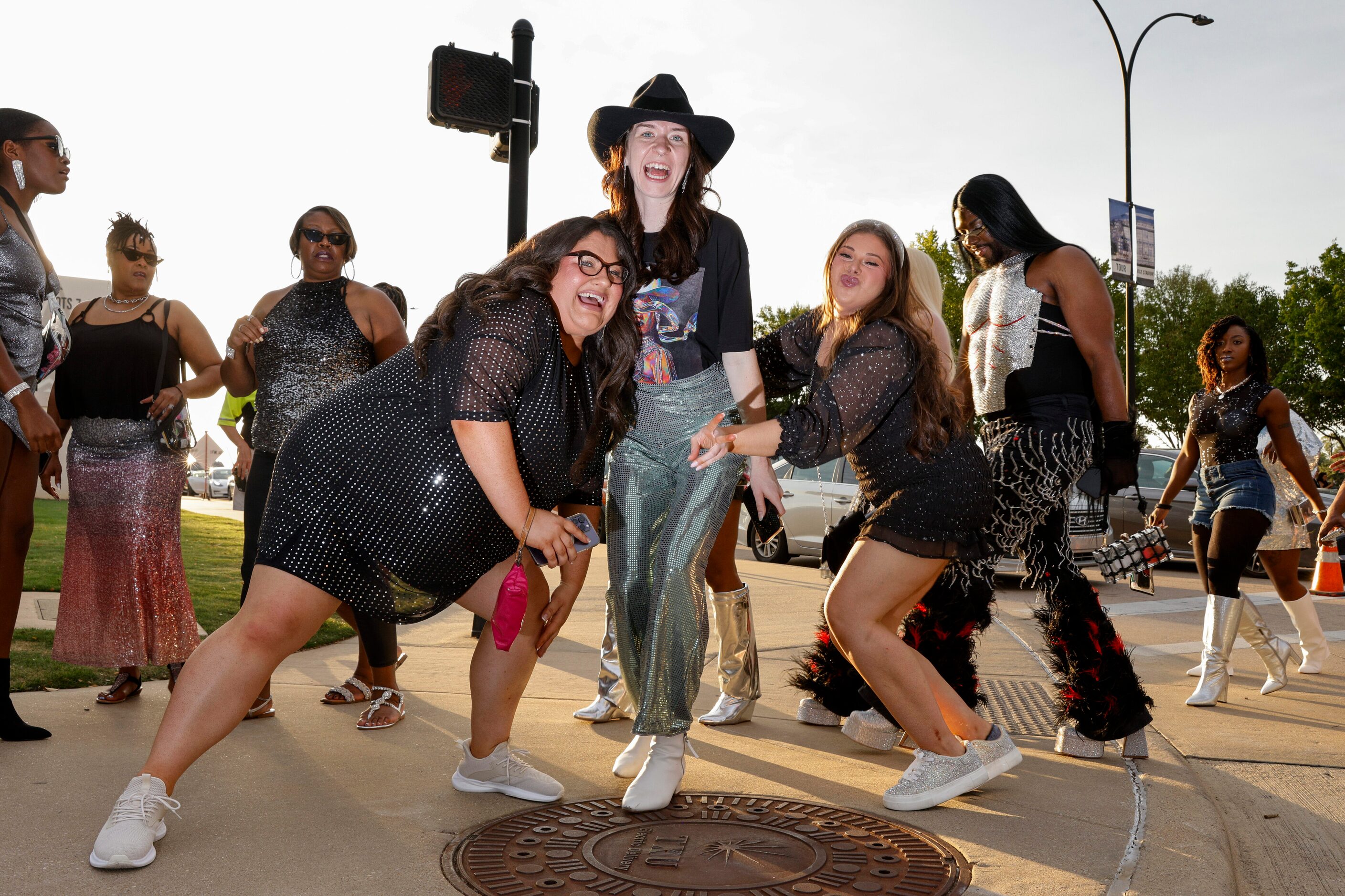 Rebecca Falter (left), Molly Claire Dyer (center) and Erica Winters pose as they walk to...