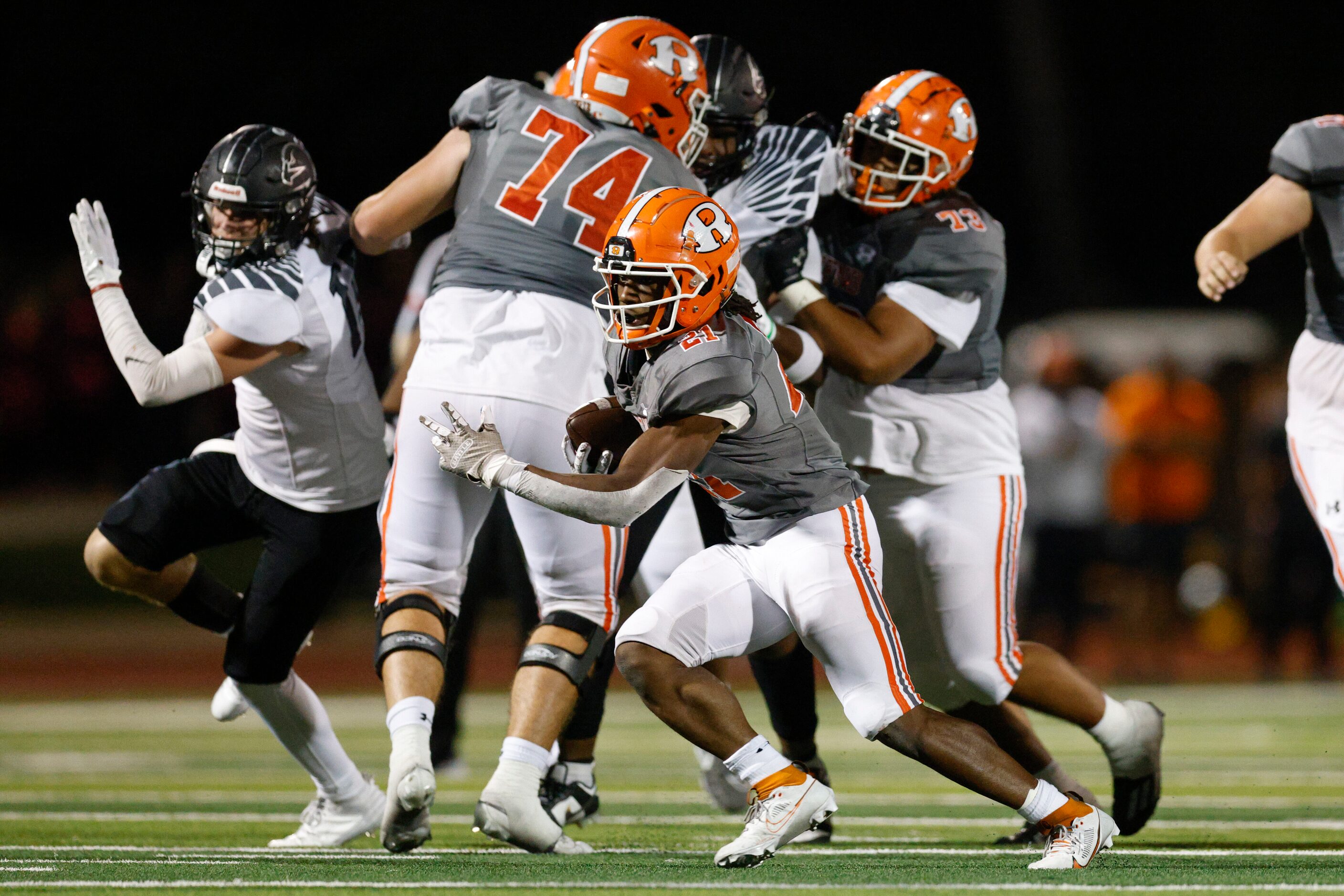 Rockwall running back Jamir Wilson (21) runs through the line of scrimmage during the first...