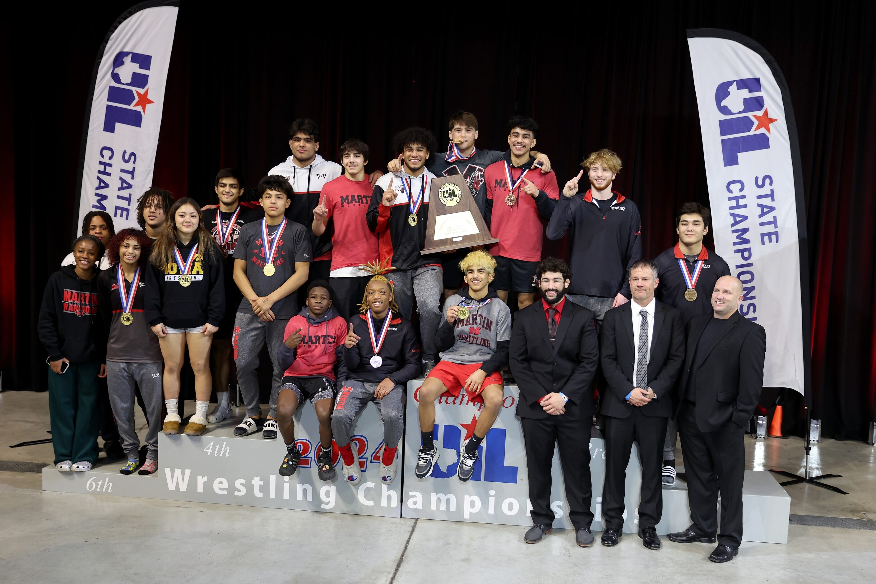 The Arlington Martin team poses for a photo after winning the 6A team championship during...