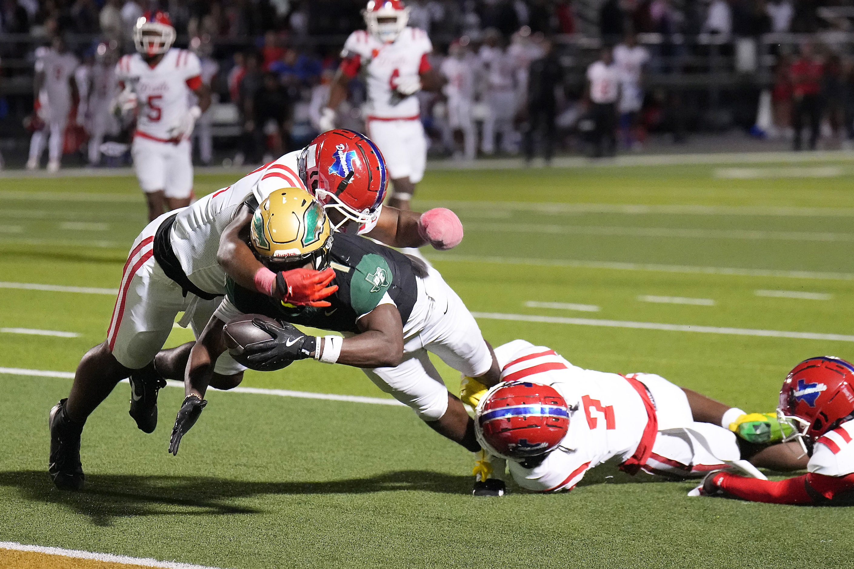 DeSoto running back Deondrae Riden Jr (1) is stopped short of the end zone by Duncanville...