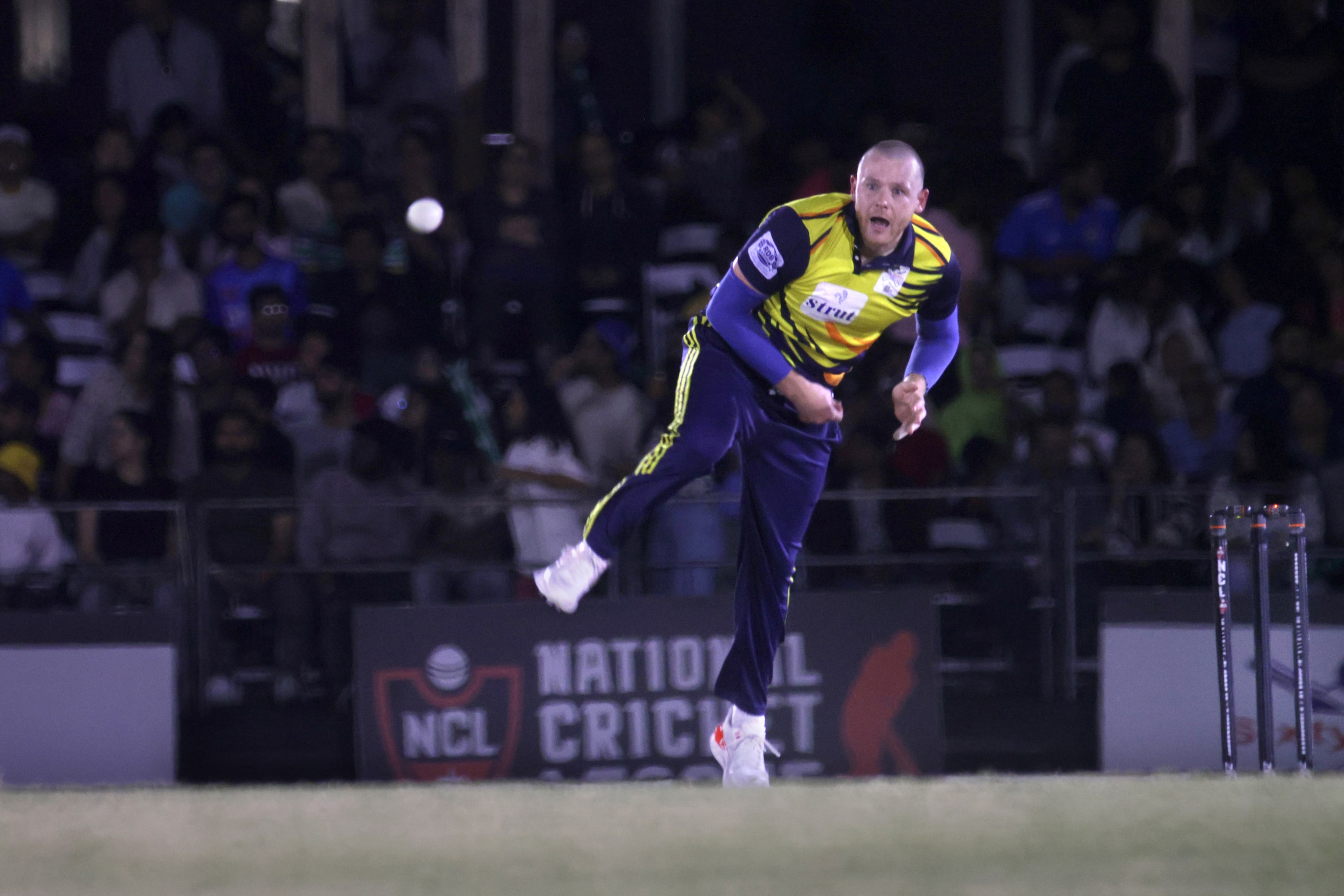 Chicago player #21 Michael Leask throws the ball as The Chicago Cricket Club plays against...