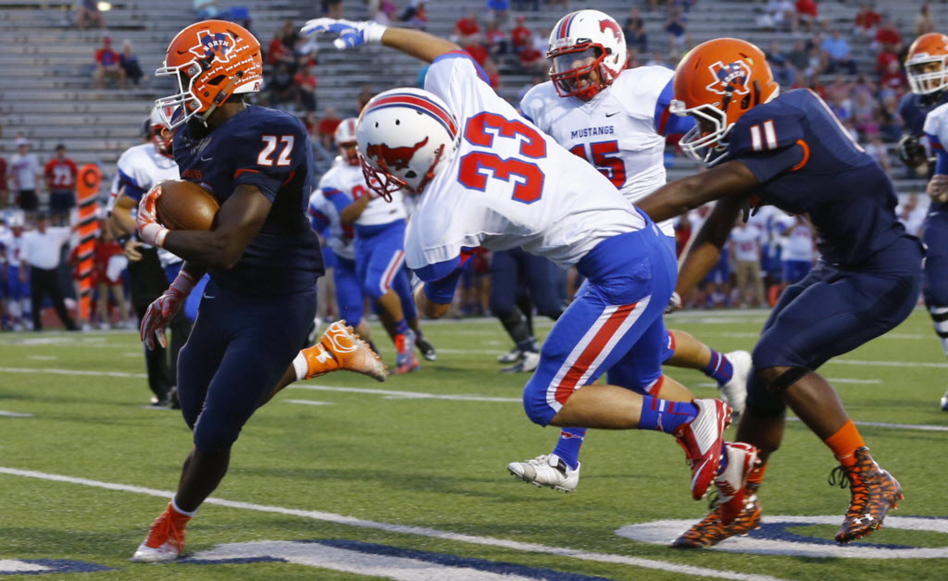 TXHSFB McKinney North running back KJ Hart (22) gets past Richardson Pearce defensive back...