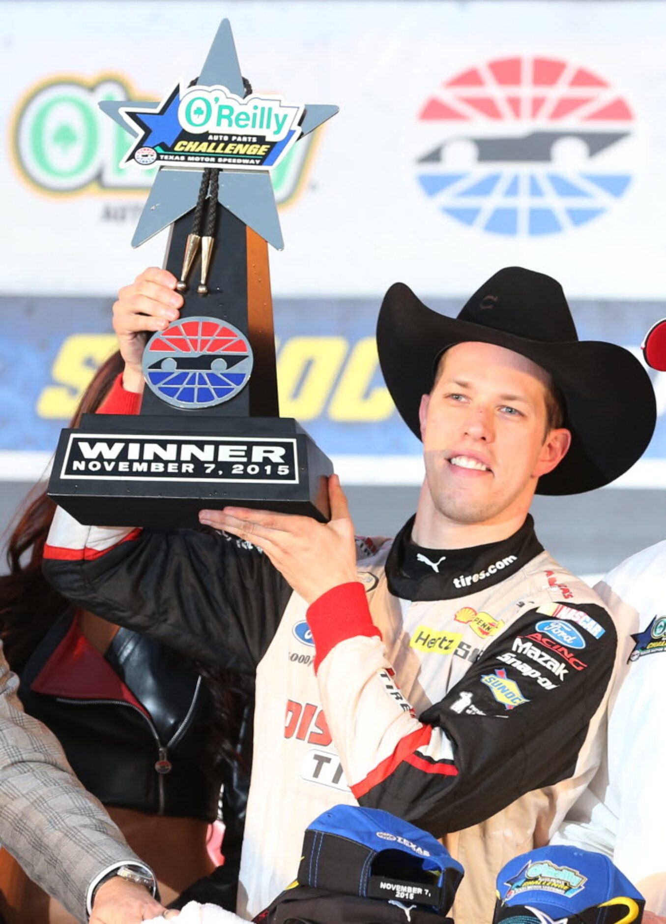 Brad Keselowski (22) hoists the trophy after winning the NASCAR XFINITY SERIES 11th Annual...