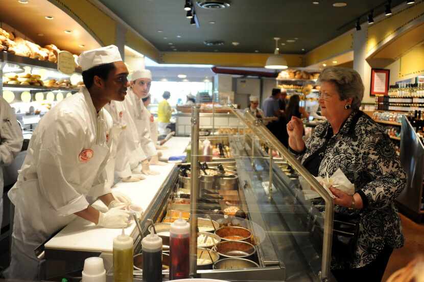 Betty Selzer orders a salad at the Salad and Sandwich bar at an Eatzi's in Plano. (Alexandra...