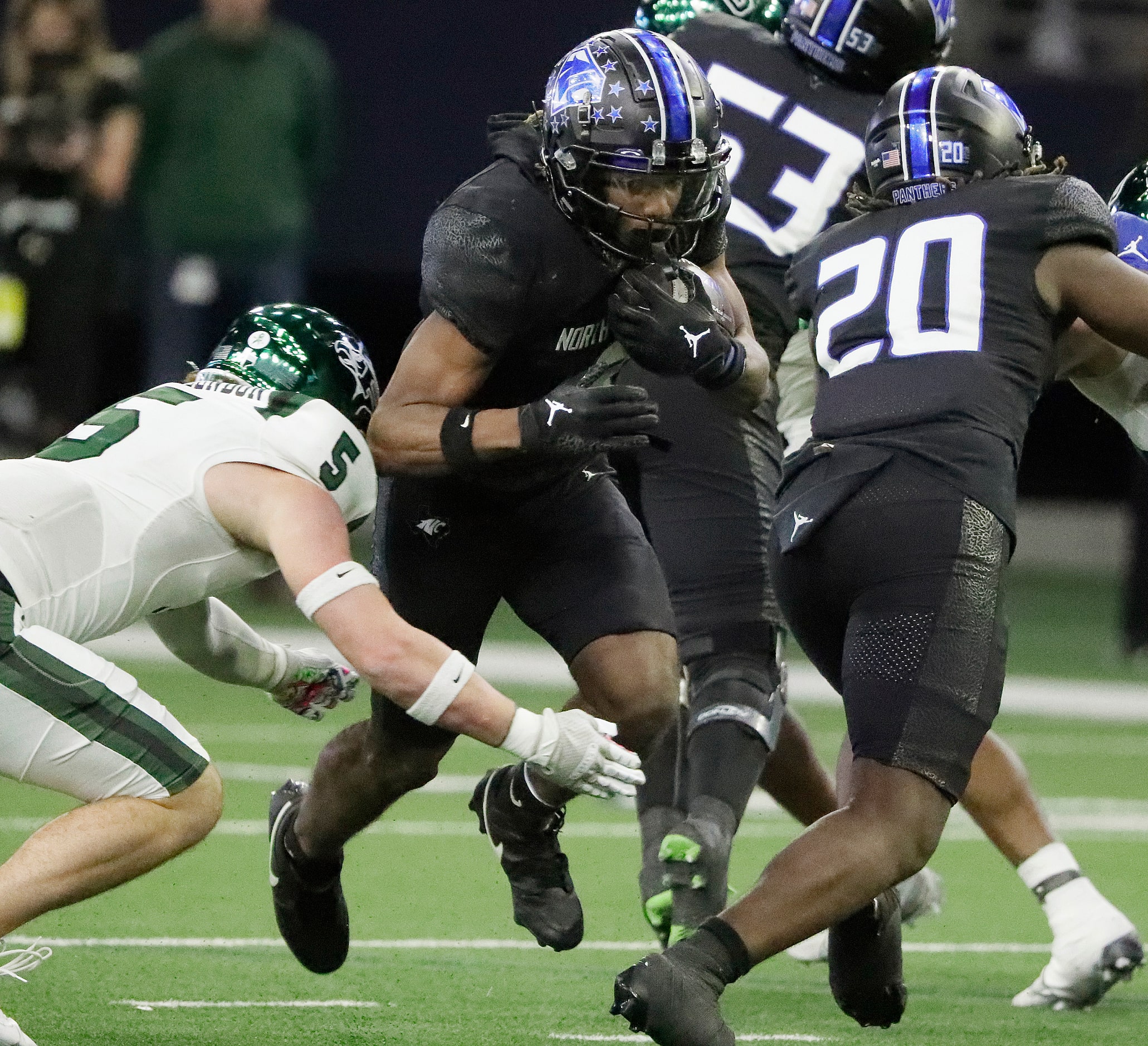 North Crowley High School running back Ashton Searl (8) is tackled by Prosper High School...