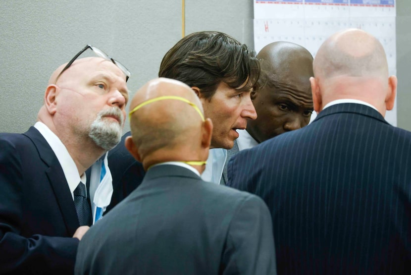 Defense lawyer Mark Watson, left, and Kobby Warren, back right, Dallas County District...