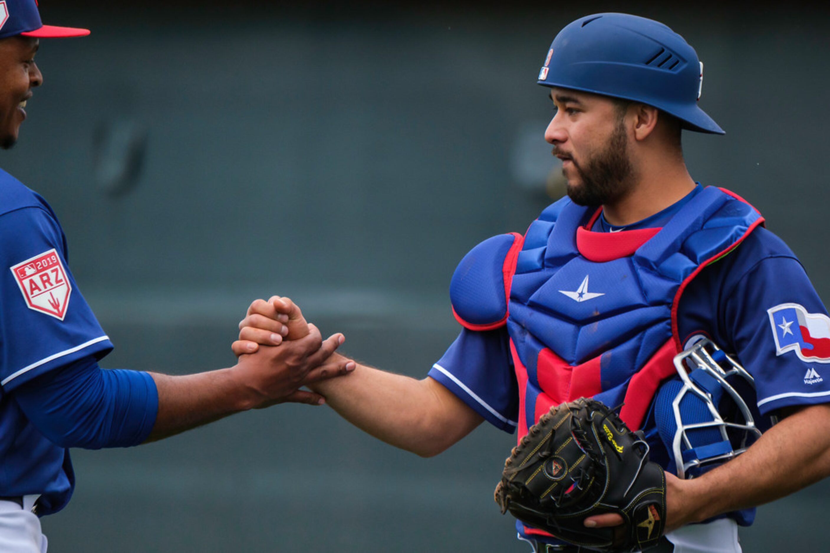 Texas Rangers pitcher Edinson Volquez shakes hands with catcher Isiah Kiner-Falefa after a...