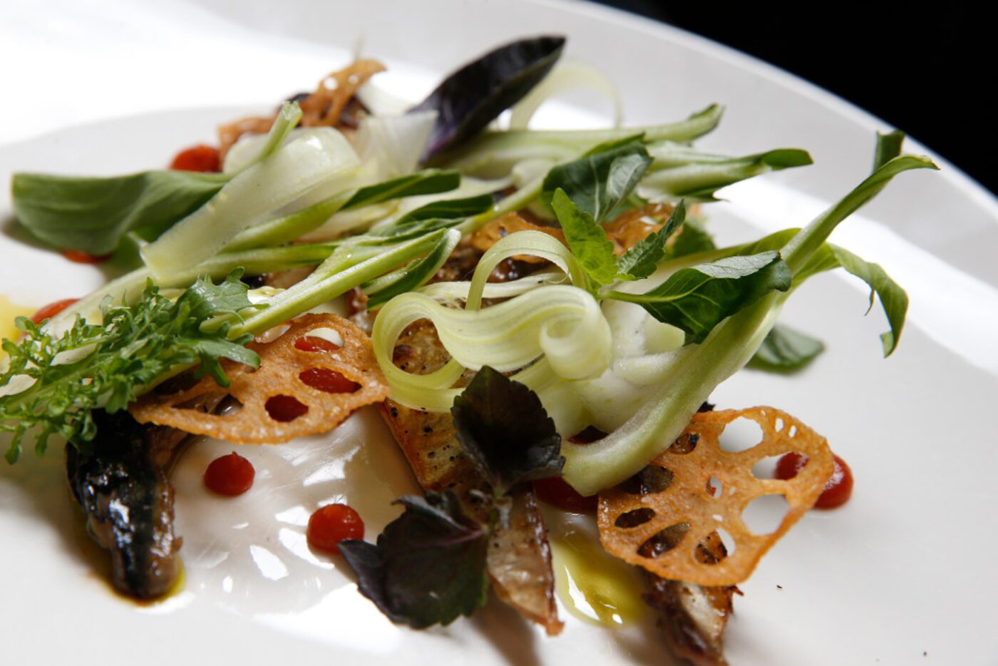 Char-grilled Norwegian mackerel with crispy bok choy, celery and lotus root chips at Mot Hai...