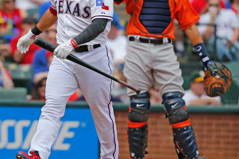 Texas Rangers left fielder Shin-Soo Choo (17) heads back to the dugout after striking out in...
