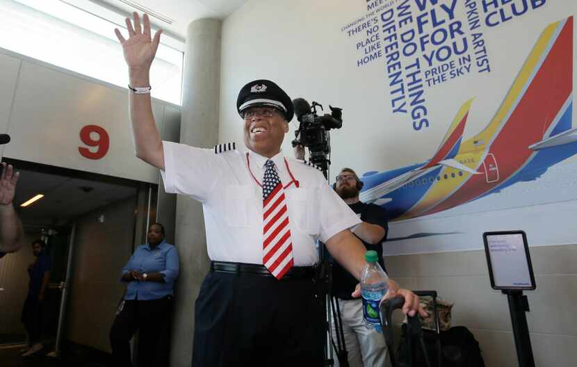 Southwest Airlines captain Louis Freeman waved before boarding a jet Thursday to fly his...