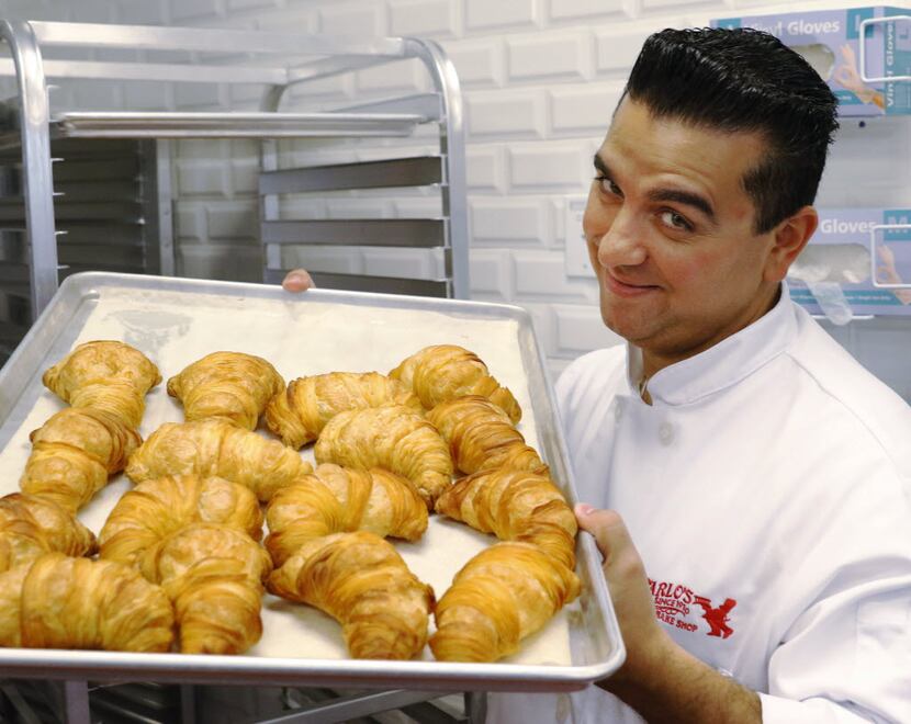 Cake Boss, Buddy Valastro holds fresh baked lobster tails at Carlo's Bakery before the...