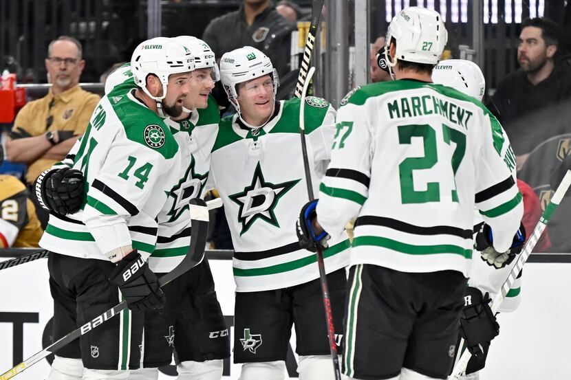 The Dallas Stars celebrate a goal by center Roope Hintz, center, against the Vegas Golden...