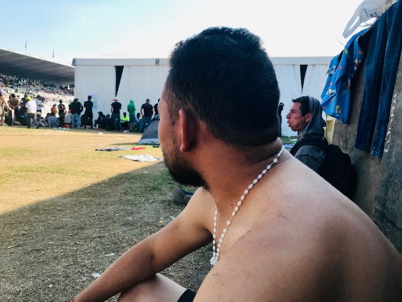 Juan Carlos Rivera, 26, of Copan, Honduras, sits in a corner of the complex, waiting for his...