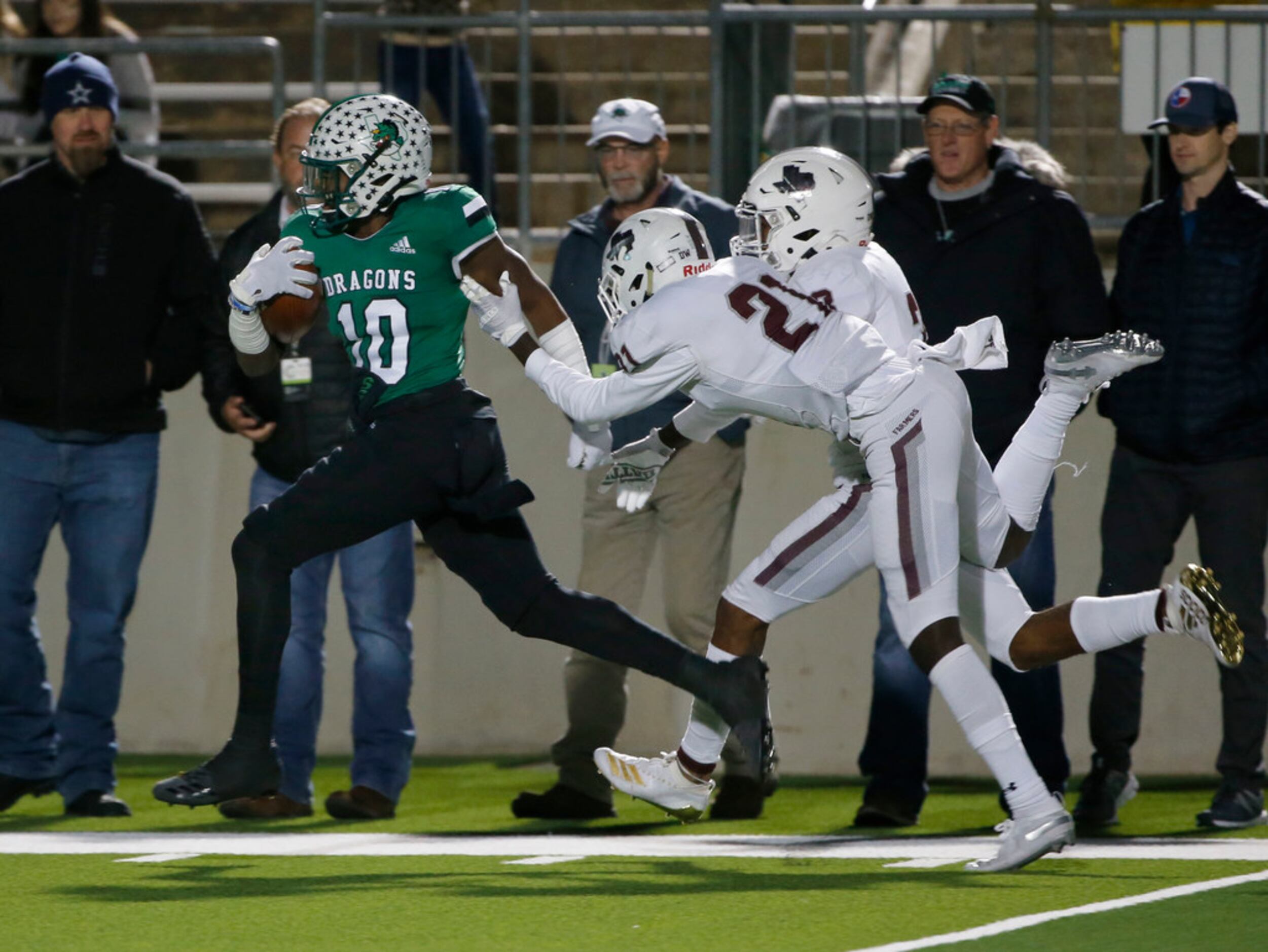 Southlake's RJ Mickens outruns Lewisville's Shadwel Nkuba II (21) an Julius Campbell (3) for...
