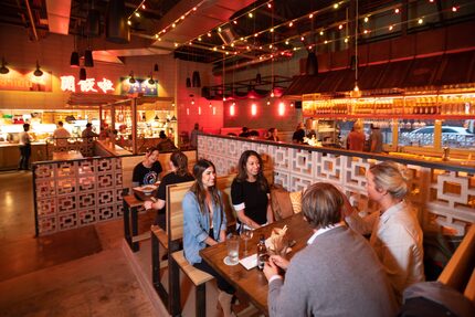 Diners Madeline Haddad, center, and Alex Kalberer, sit with Chris Dalton, right, and...