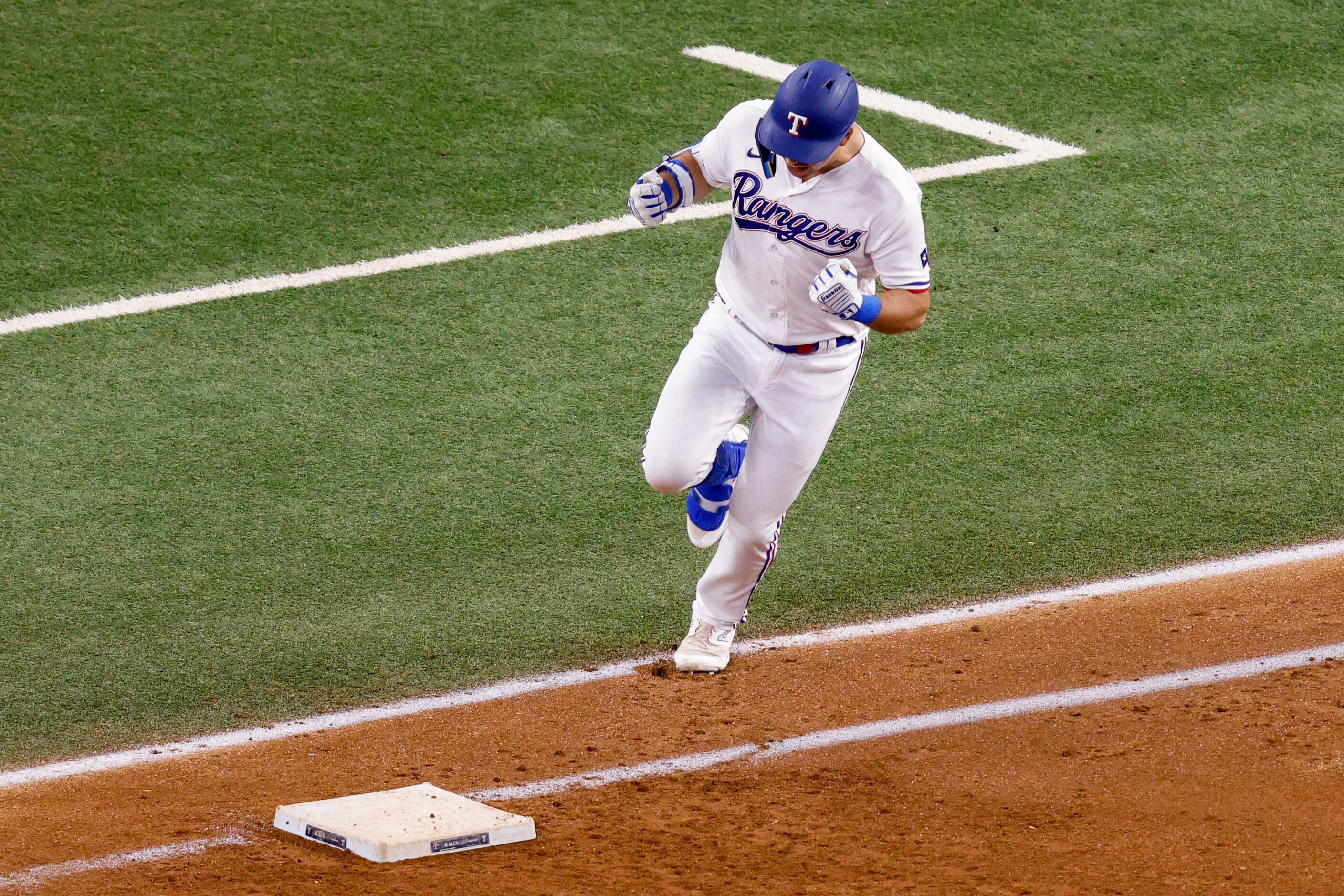 Texas Rangers first baseman Nathaniel Lowe (30) celebrates after hitting a home run off of...