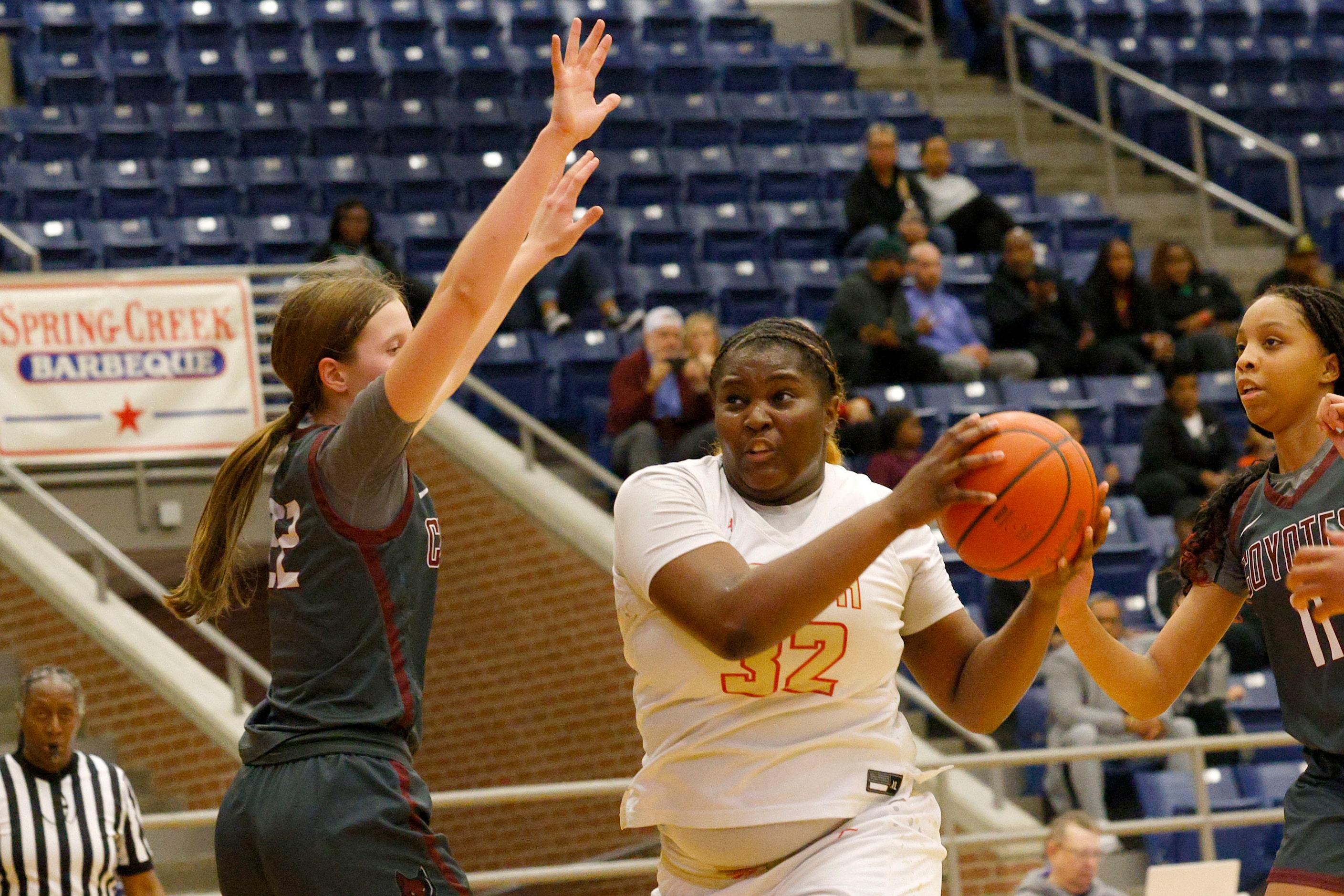 South Grand Prairie's Cedraiah Peterson (32) keeps the ball away from Frisco Heritage's...