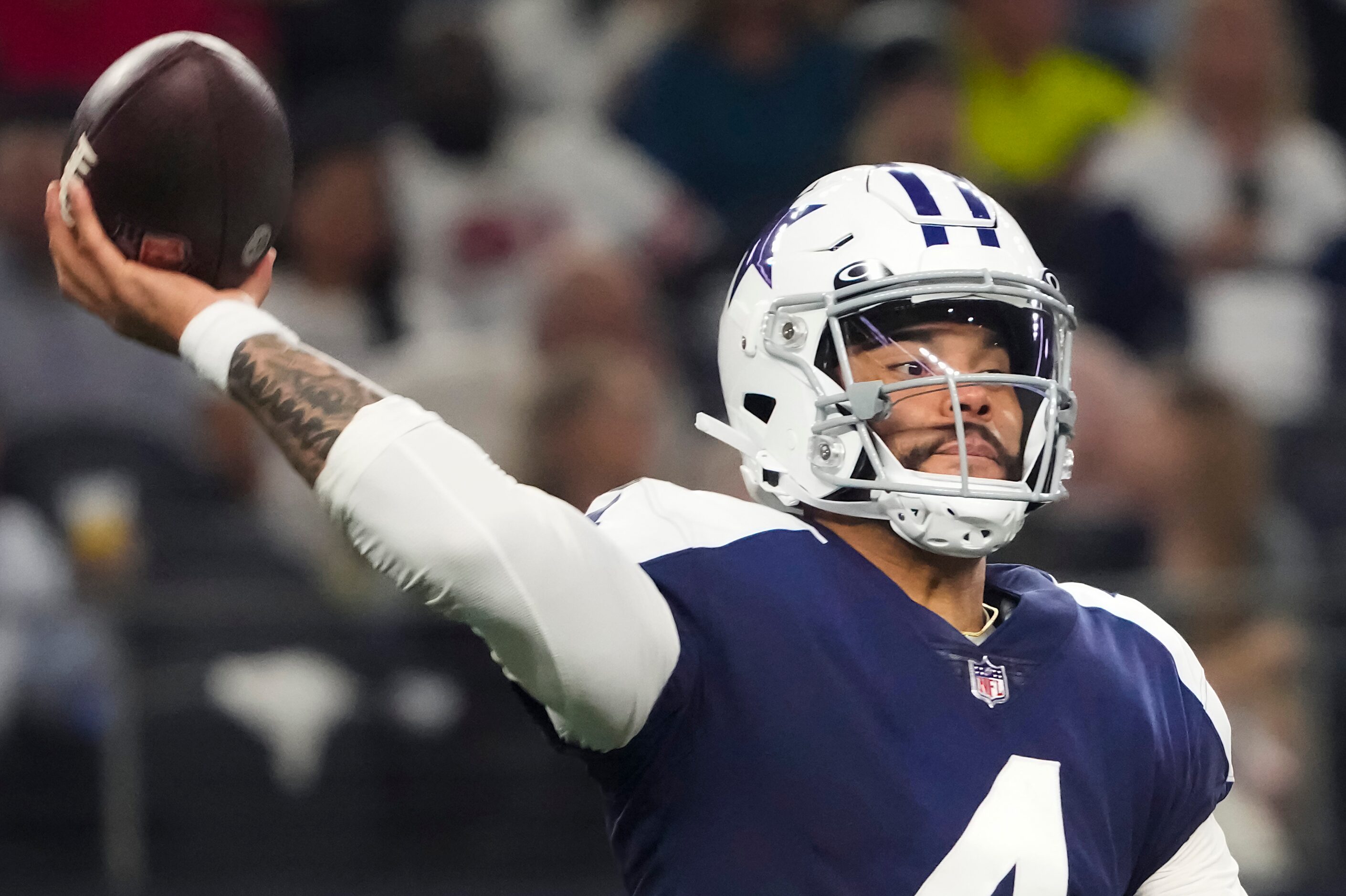 Dallas Cowboys quarterback Dak Prescott (4) throws a pass during the first half of an NFL...