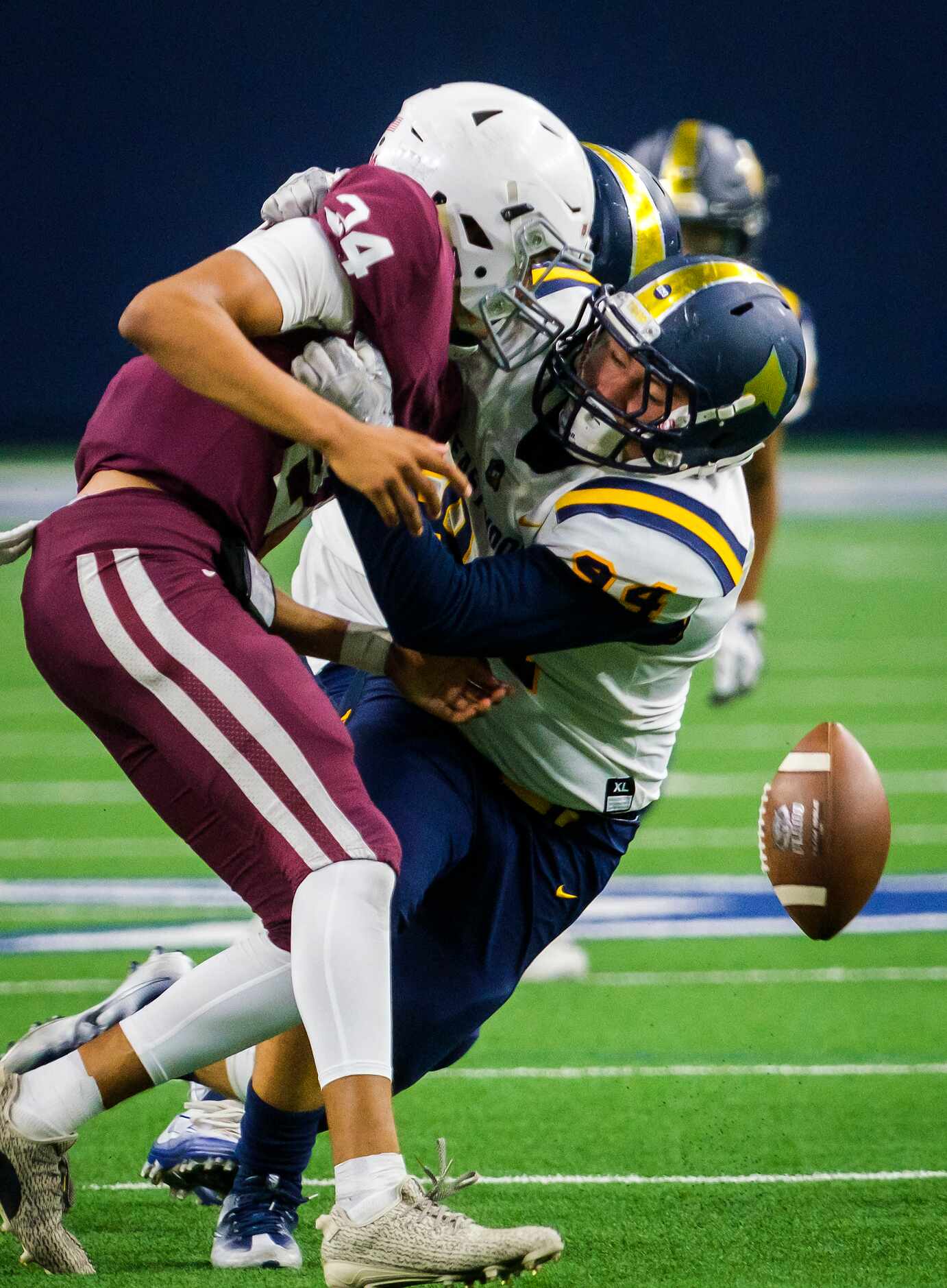 Plano quarterback Oliver Towns (24) loses the ball as he is sacked by El Paso Eastwood...