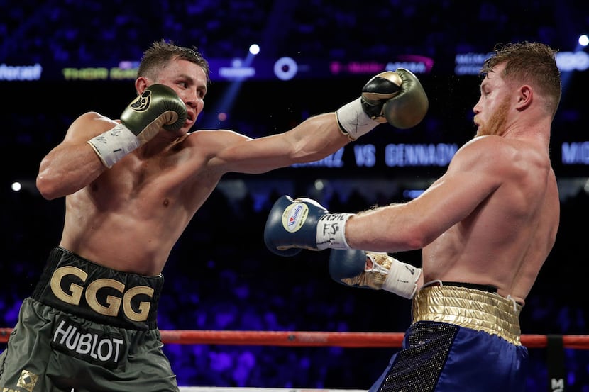 Gennady Golovkin, left, fights Canelo Alvarez during a middleweight title fight Saturday,...