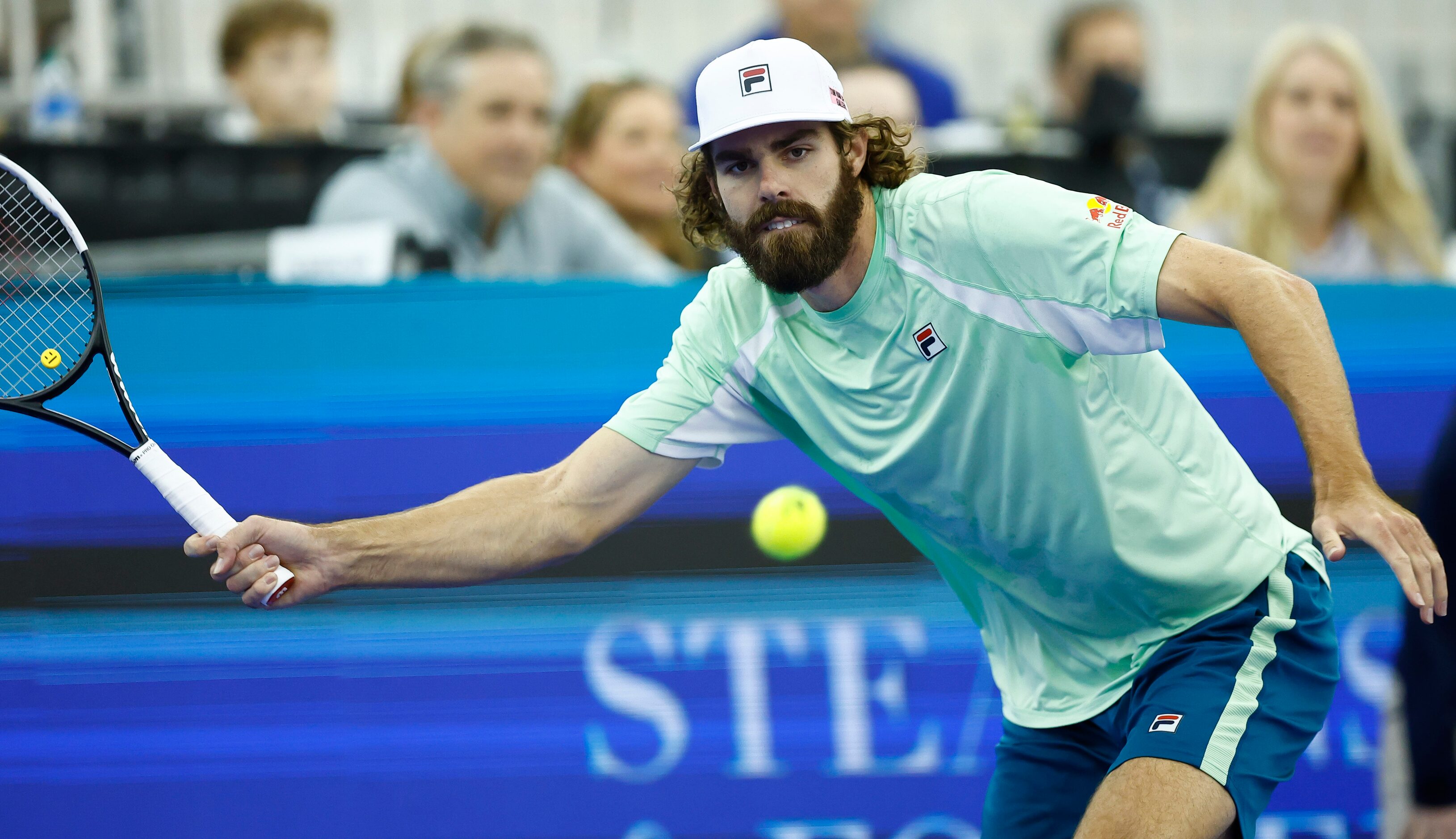 Reilly Opelka returns the ball during the finals ATP Dallas Open against Jenson Brooksby at...