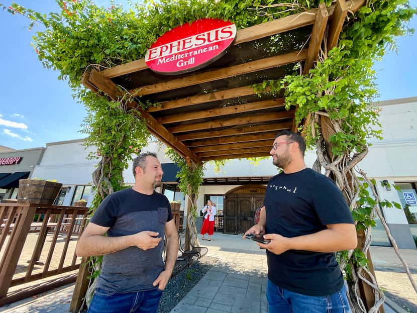 Hasan Meseogly (left) and Ali Kayan (right) have waited each day outside their restaurant,...