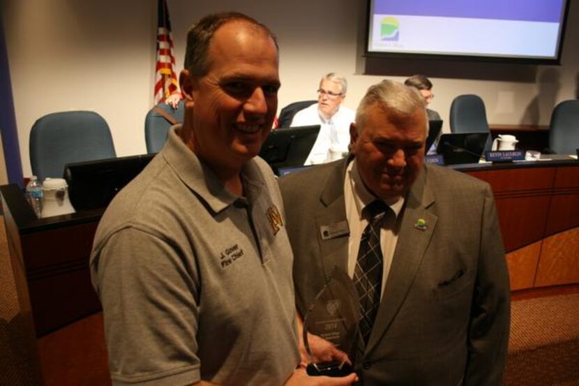 
Highland Village Fire Chief John Glover (left) and Mayor Patrick Davis show off the Heart...