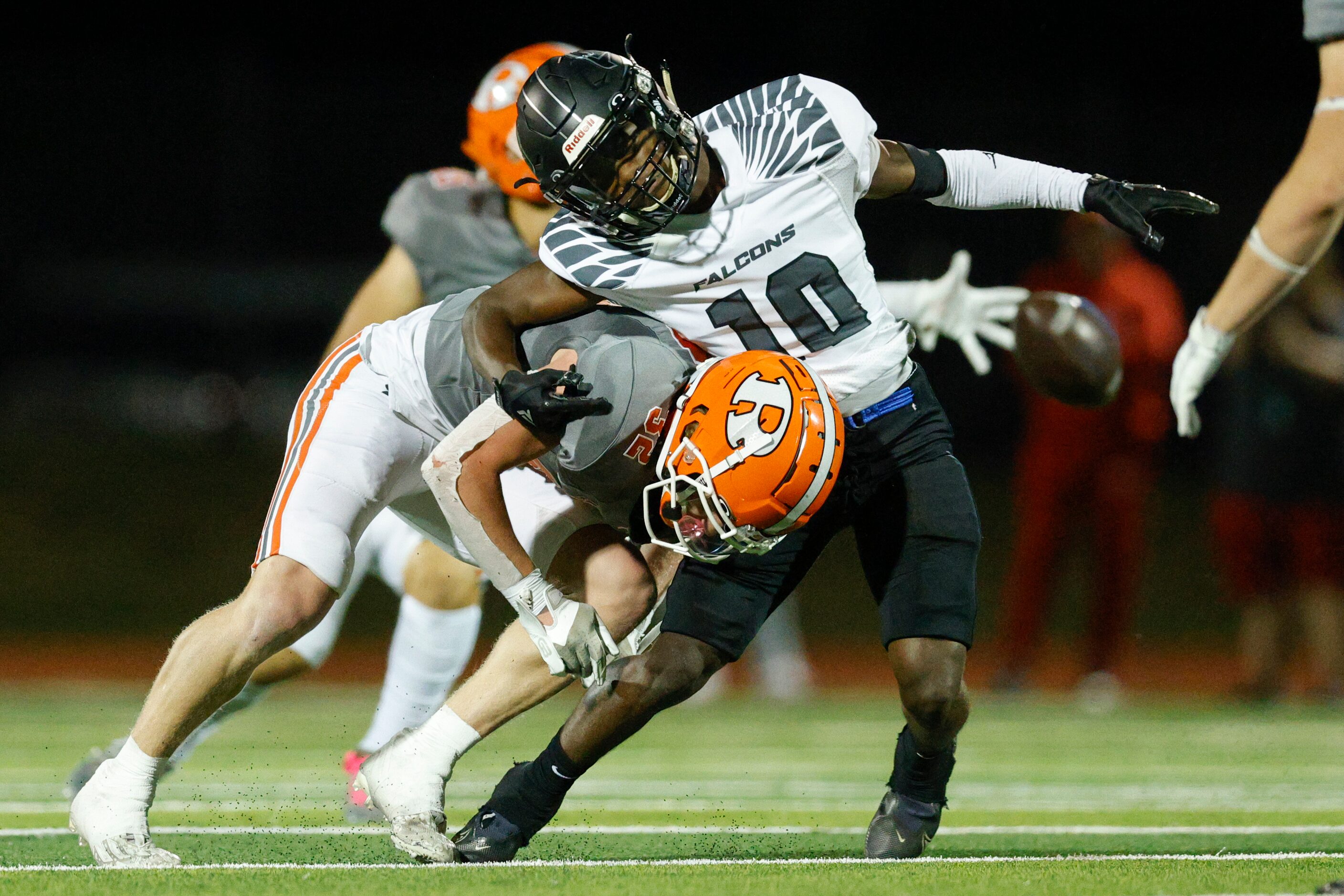 Rockwall safety Will Ashworth (32) hits North Forney wide receiver Brendon Ross (10) as he...