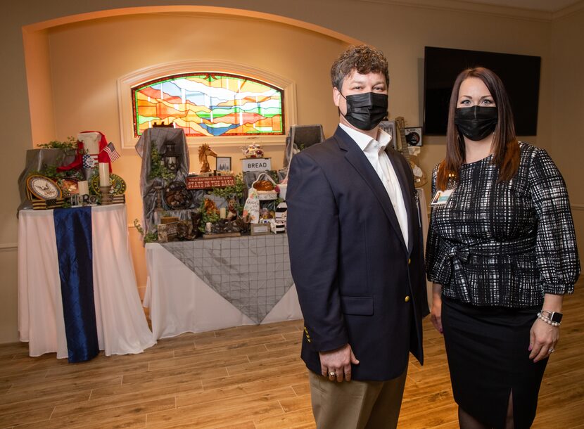 Sam Scott and Kristine Reed in front of the life story display at Ted Dickey West Funeral...