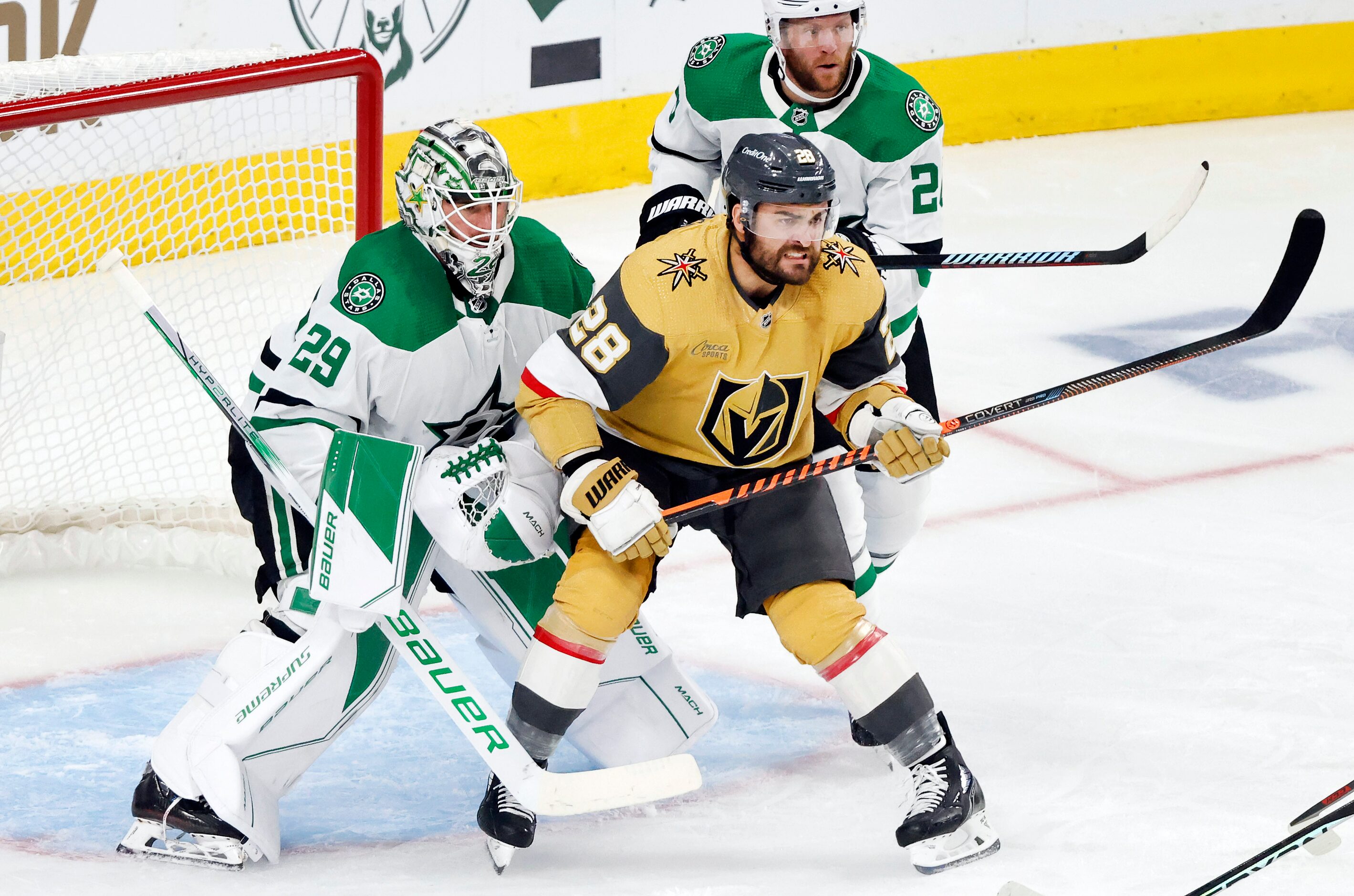 Vegas Golden Knights left wing William Carrier (28) muscles to the font of the net against...