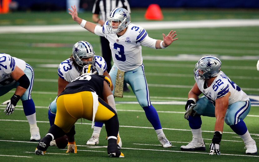 Dallas Cowboys quarterback Garrett Gilbert (3) changes a play at the line of scrimmage...