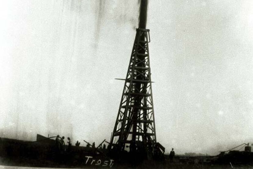 In this 1901 photo provided by the Texas Energy Museum, the Lucas gusher at Spindletop blows...