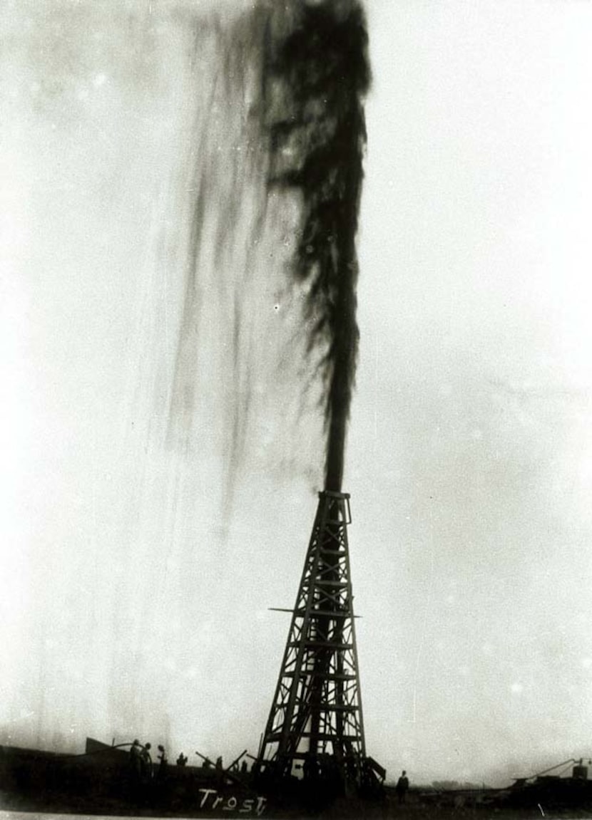 In this 1901 photo provided by the Texas Energy Museum, the Lucas gusher at Spindletop blows...