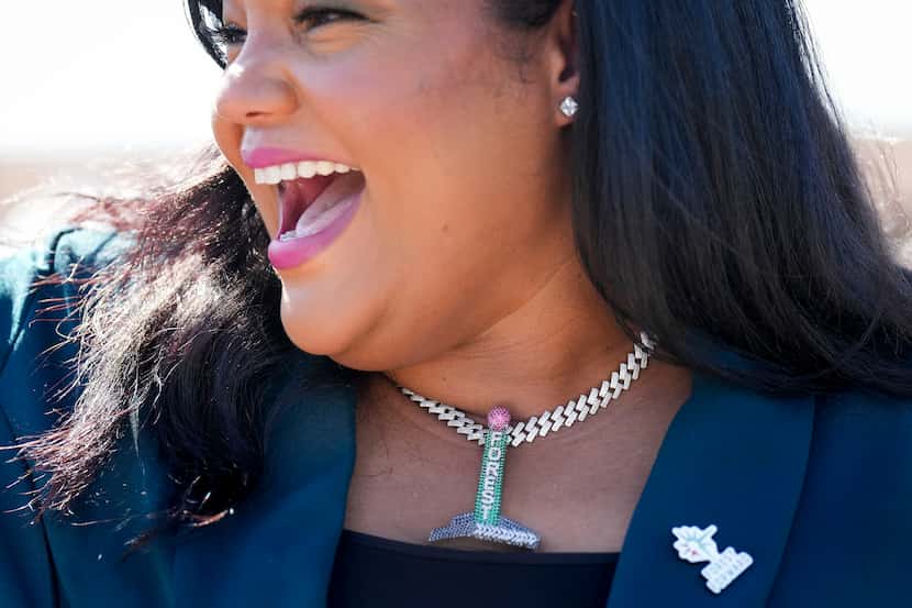 Elizabeth Wattley, founder and CEO of Forest Forward, wears a necklace with a replica of the...