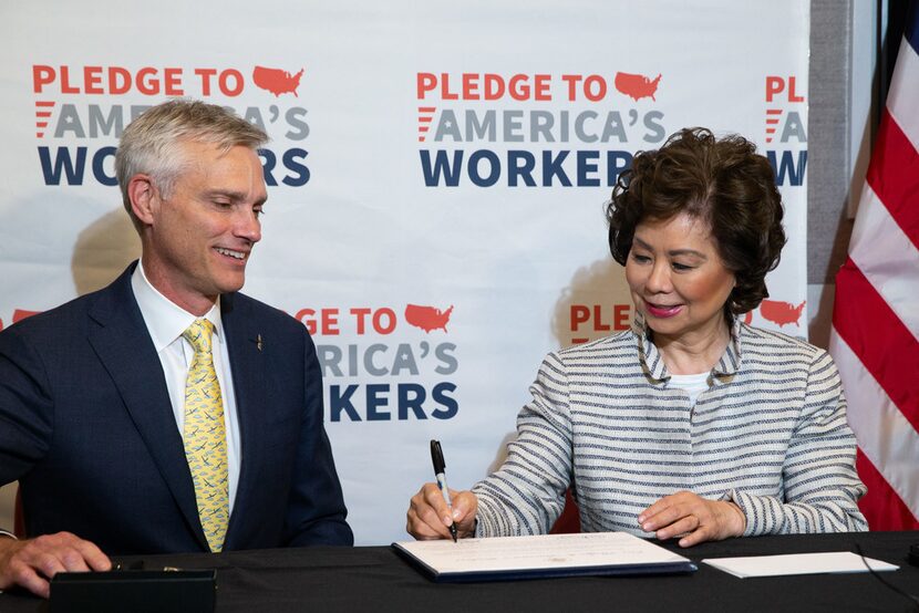 U.S. Transportation Secretary Elaine Chao (right) joins American Airlines President Robert...