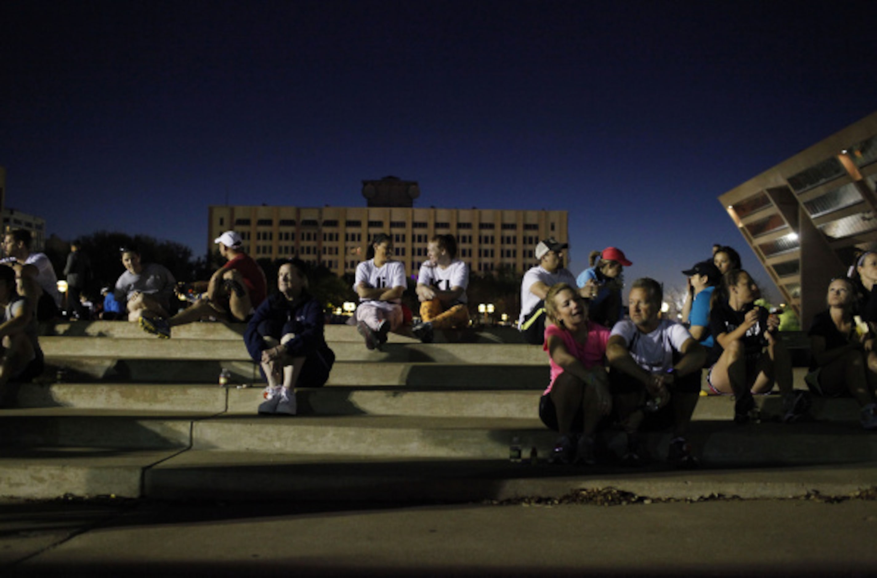 Dallas Rock 'N' Roll half marathon participants wait near city hall for the race to begin on...